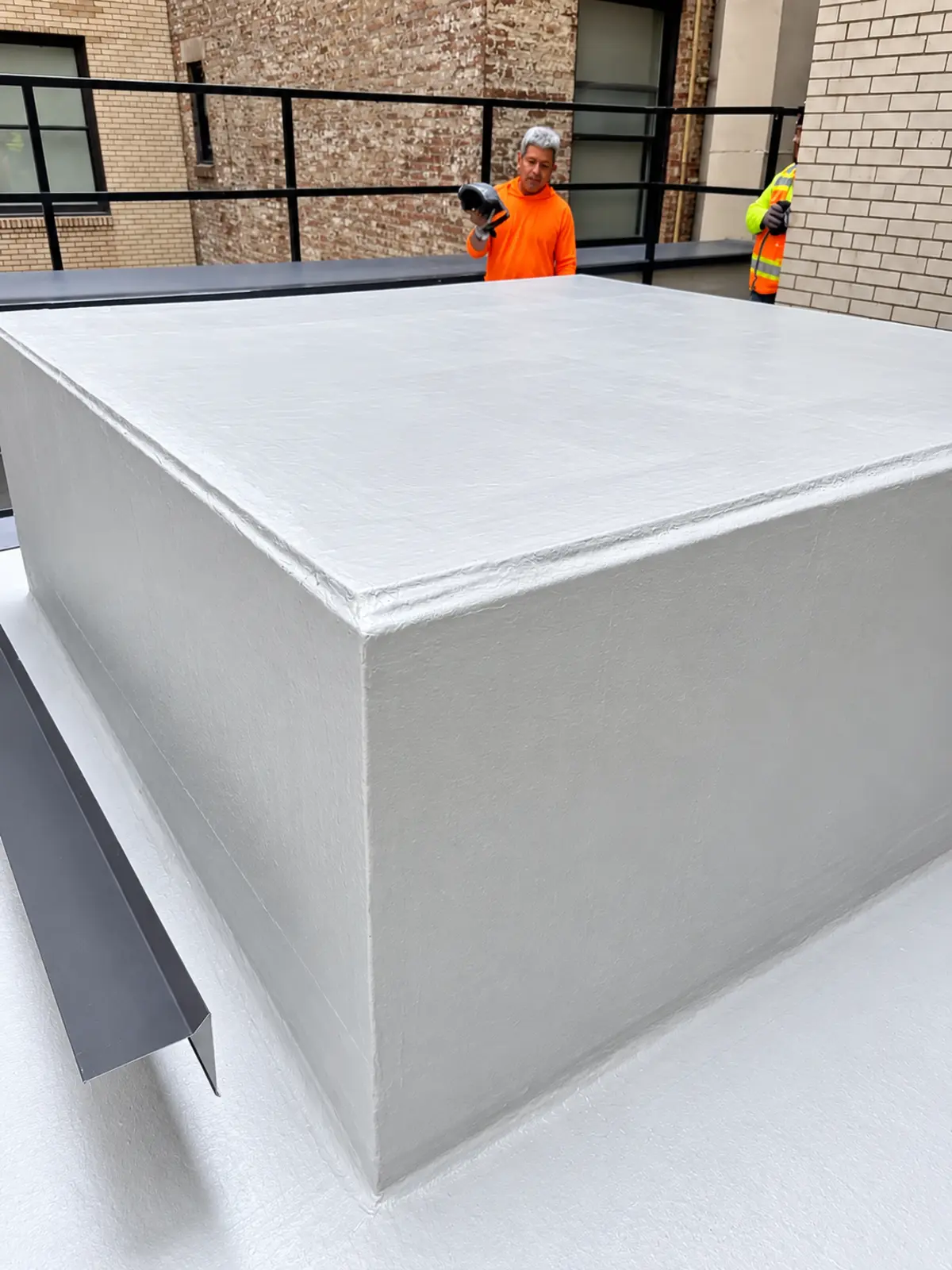 Completed courtyard waterproofing around a raised structure