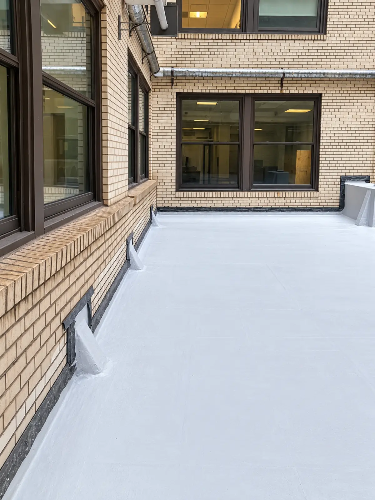 Completed roof work shown across the full finished area