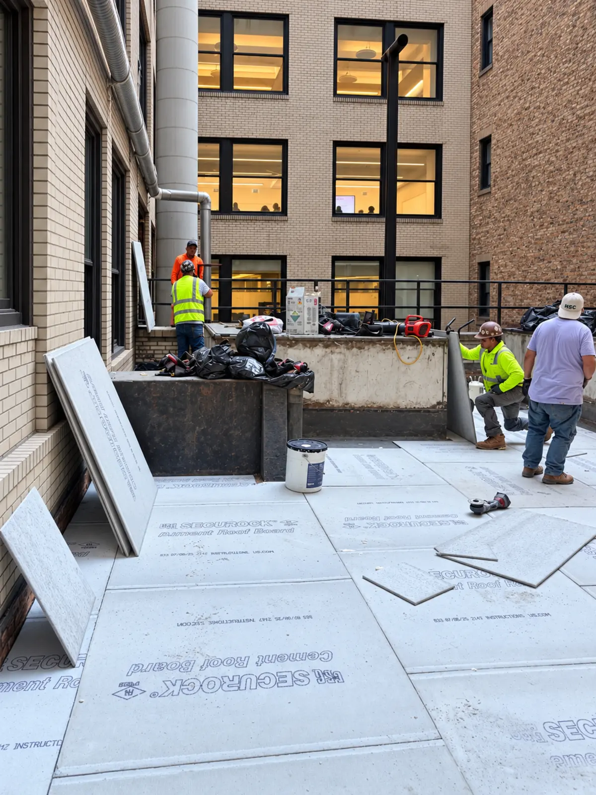 Courtyard insulation installation in progress