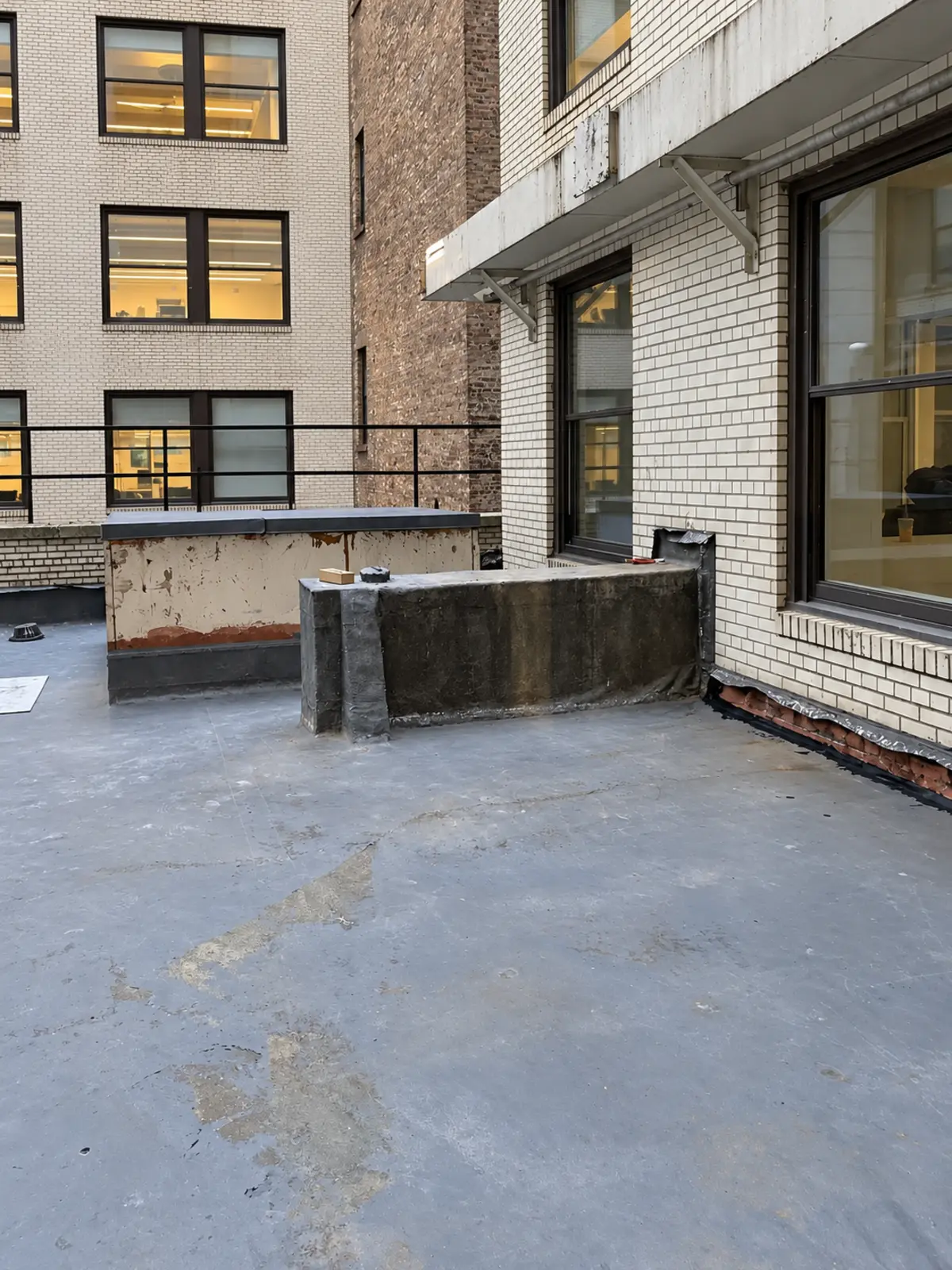Waterproofing surface installation across the courtyard